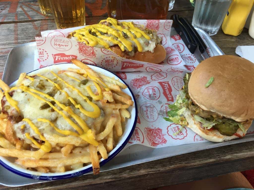 Meat Liquor’s Triple Chili Challenge includes a green chili burger, chili dog and a bowl of chili fries. Photo credit: Kevin Lee 