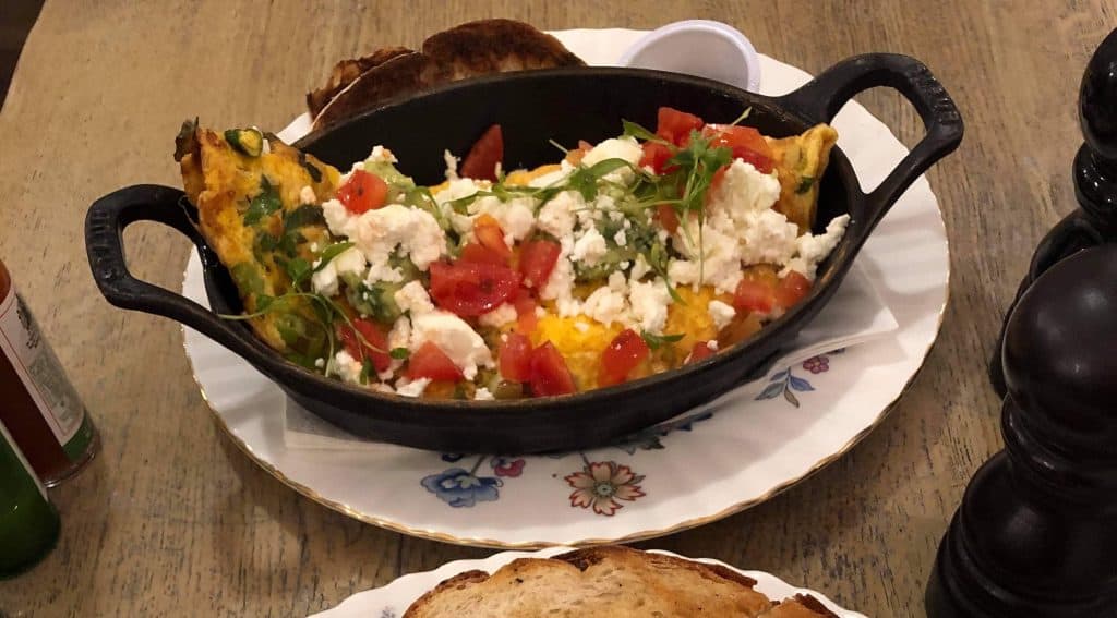 Omelette with avocado and sourdough bread from the popular brunch spot, Eggbreak.