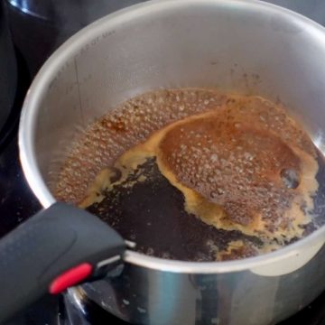 Boiling sugar and water to make syrup