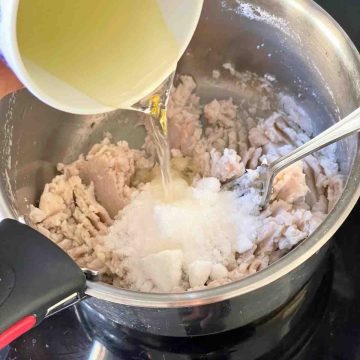 add sugar and oil into mashed taro paste