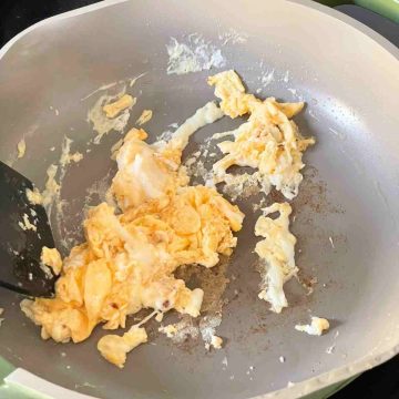 fry beaten eggs in pan