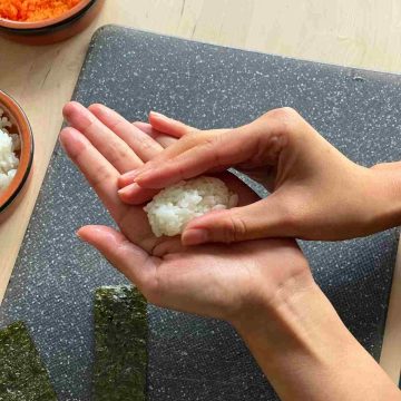 shaping sushi rice with hand