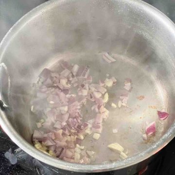 stir fry red onions garlic in pot