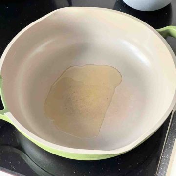 adding oil to a pan
