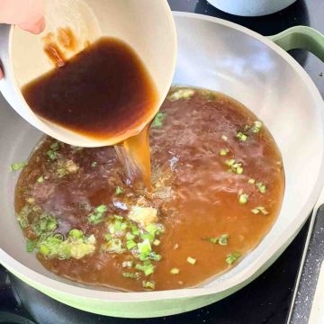 adding sauce mix to ginger spring onion