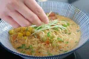 Add toppings and garnish to your instant noodles