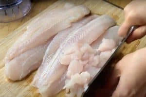 Cut and chop the fish fillets