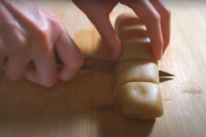 Divide the dough roll into equal portions