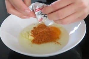 Mix egg, garlic and spice mix from the ramen pack