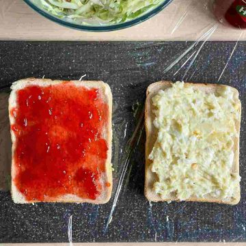 spread jam and egg potato on bread