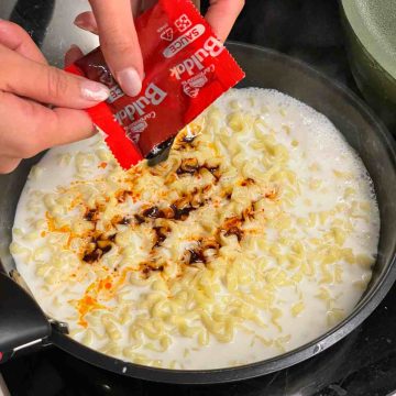Adding spice pack to milk and instant noodles