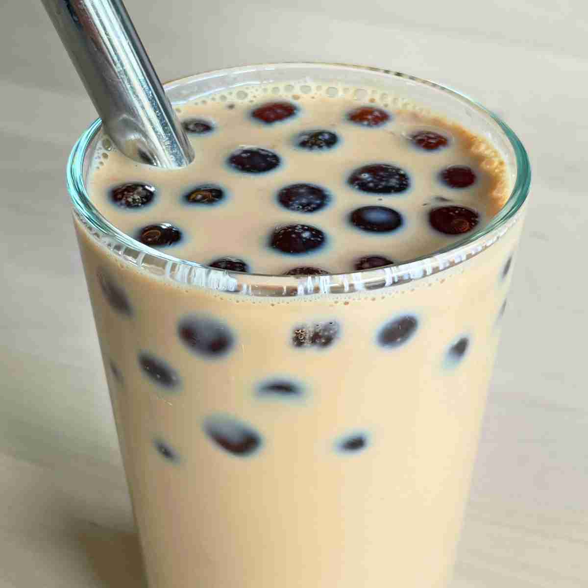 Coffee popping boba with milk tea