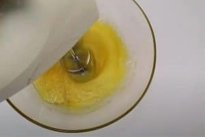 Mix eggs, sugar, ovalette and vanilla essence.