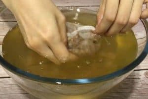 Rub and squeeze the seeds in a bowl of water