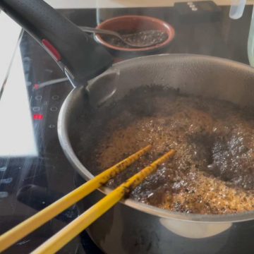 Brewing cha yen mix over the stove