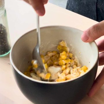 Mixing corn, mayonnaise, mozzarella