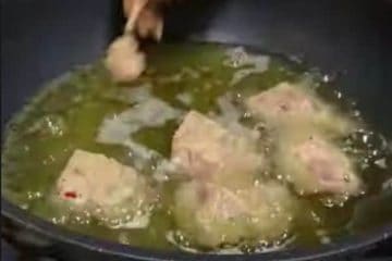 Heat oil until boiling just enough to cover the meat