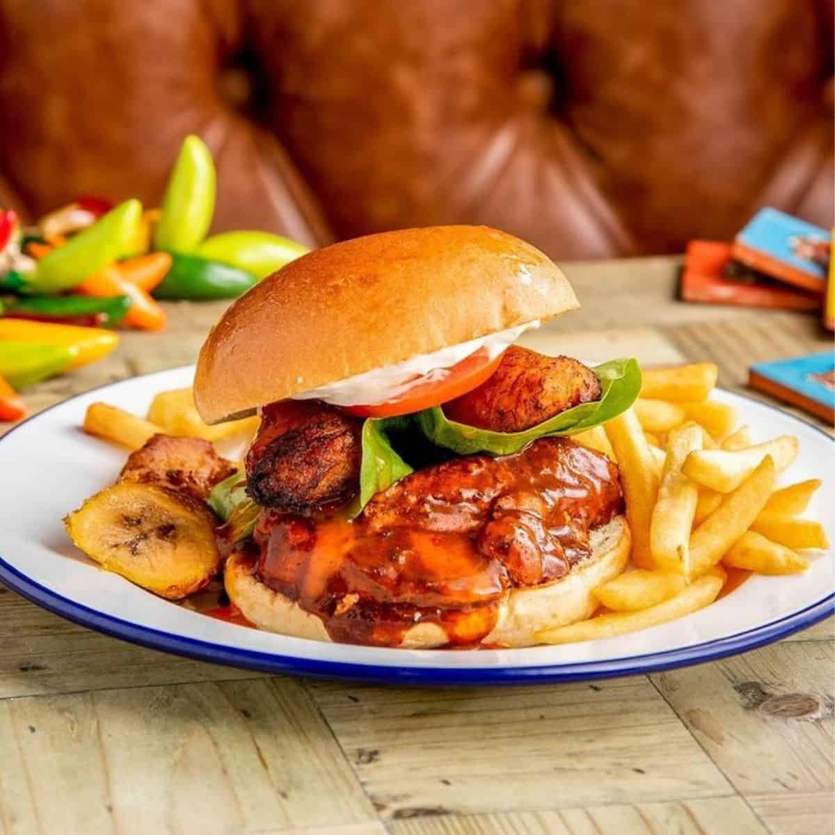 Halal Jerk Chicken Burger with lettuce and tomatoes Habaneros London
