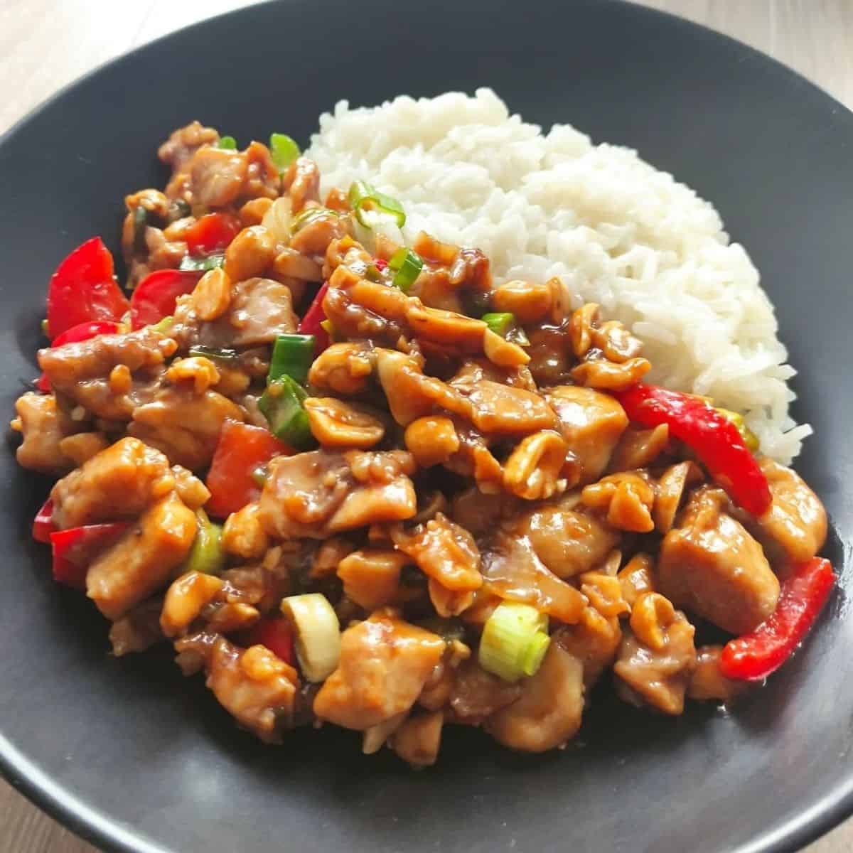 kung pao chicken with peppers, peanuts and spring onions