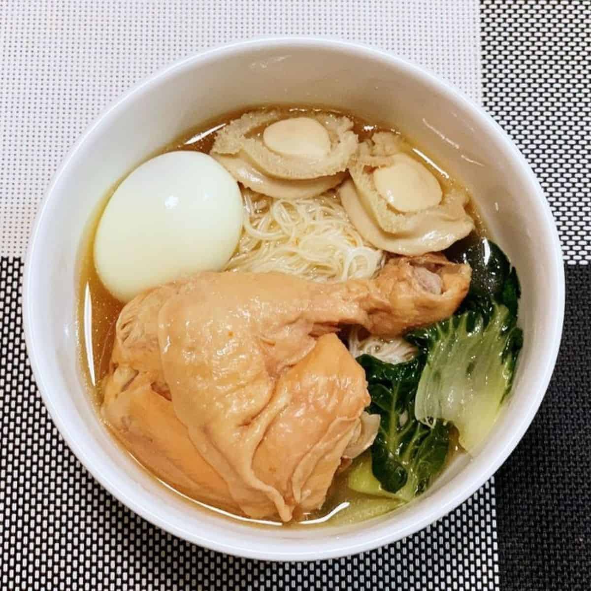 Long life yi mian in broth, with egg, chicken and bok choi