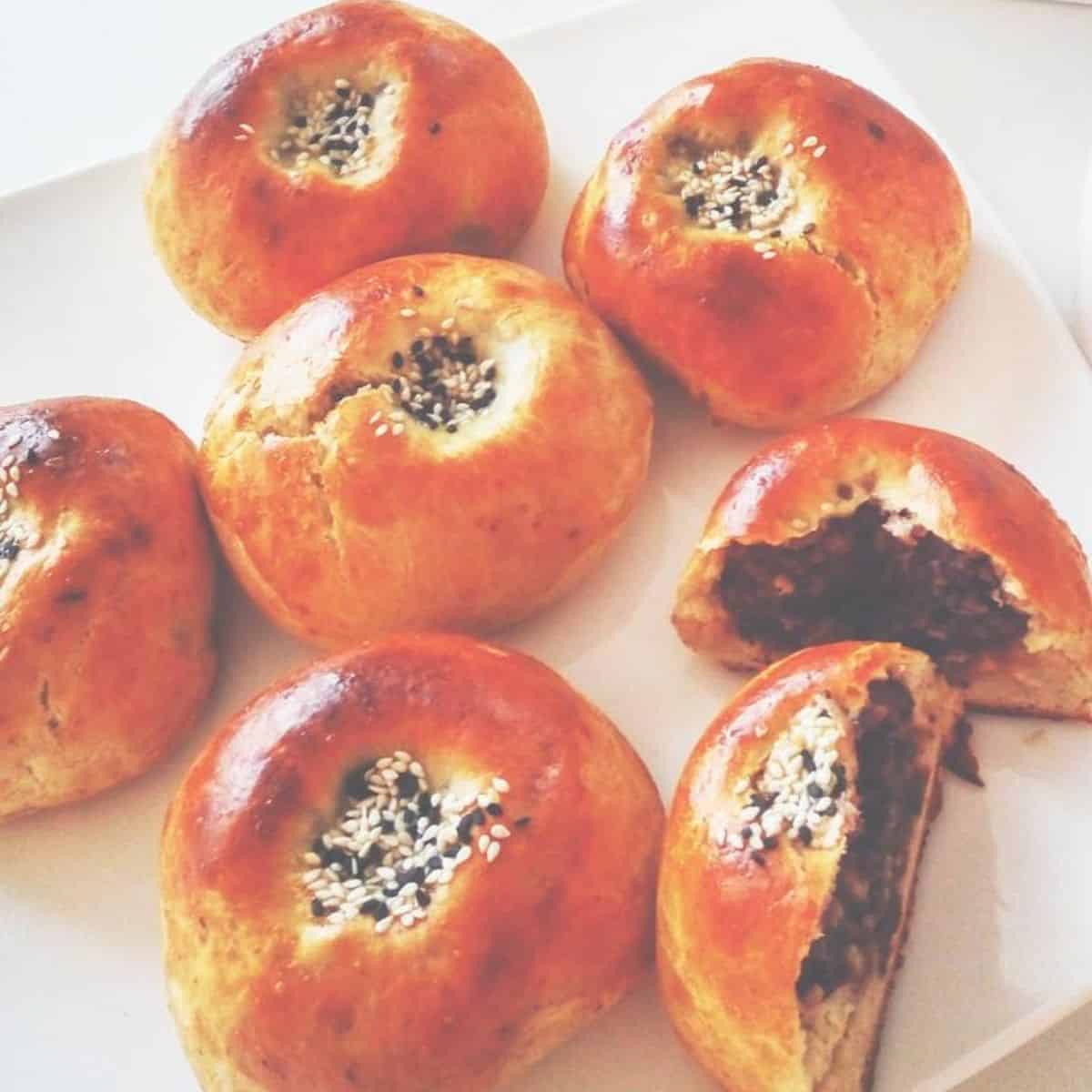 Anpan with black and white seasame seeds, filled with red bean paste