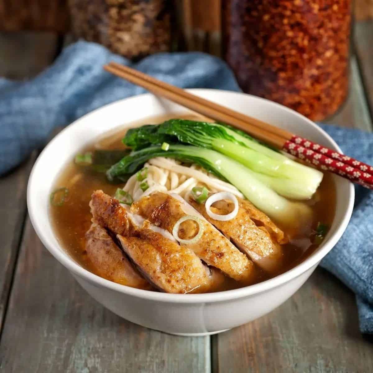 a bowl of roast chicken noodle soup Duck and Noodle