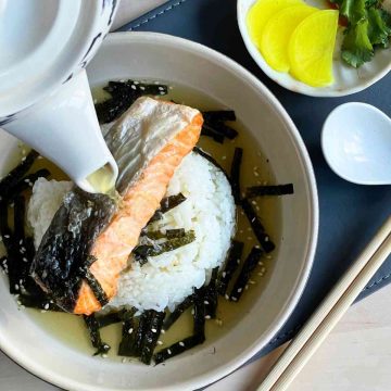 pour green tea over salmon and rice