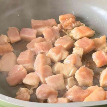 fry chicken pieces in pan till brown