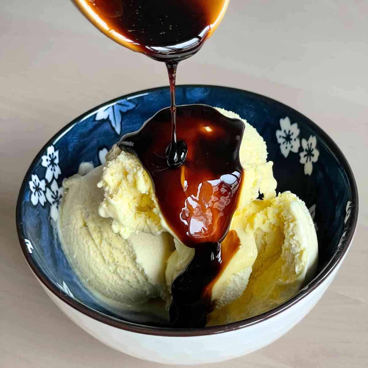 pouring the syrup over ice cream