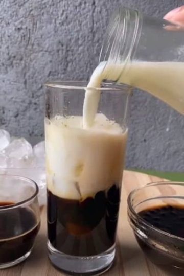 Assemble your drink with ice, milk and coffee brew