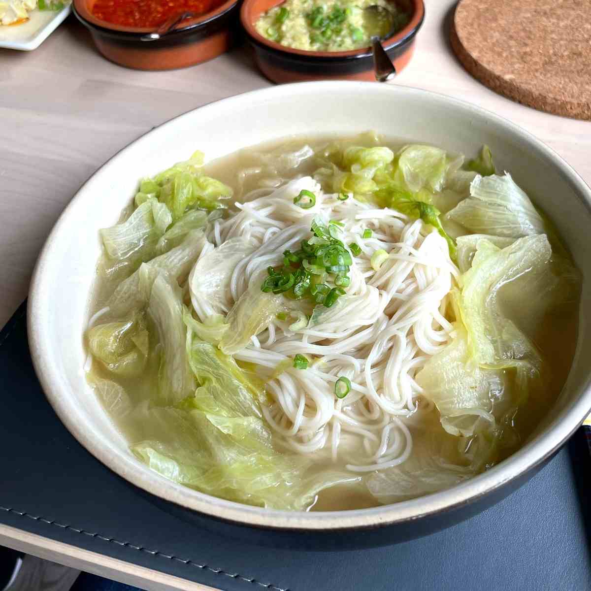 Thin rice noodles in longevity noodle soup