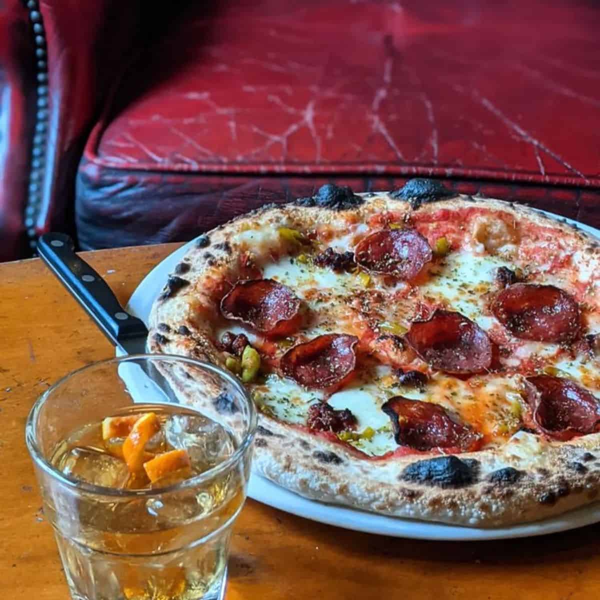 pepperoni pizza and iced drink The West Hill Tavern