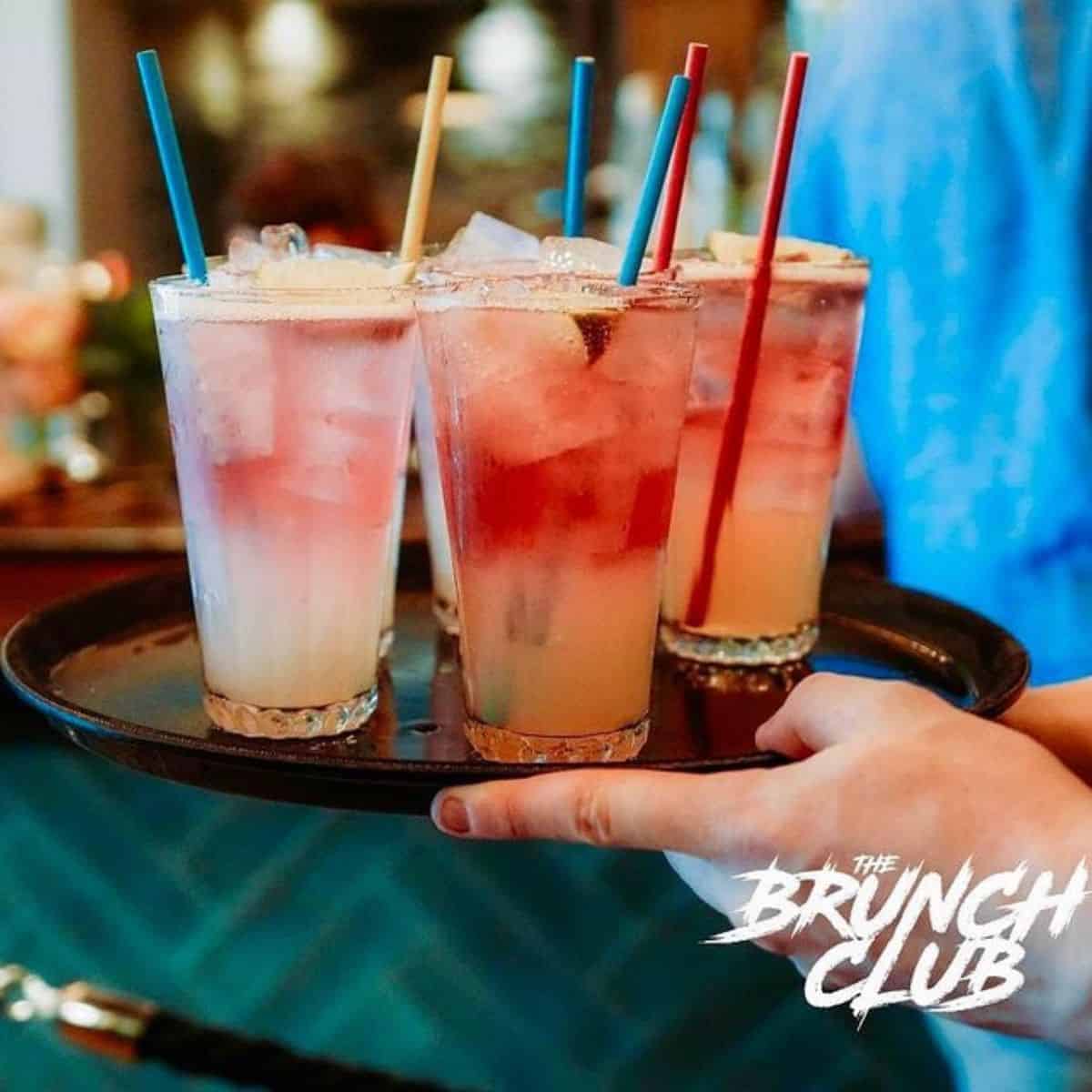 served beautiful cocktail glasses on tray The Brunch Club
