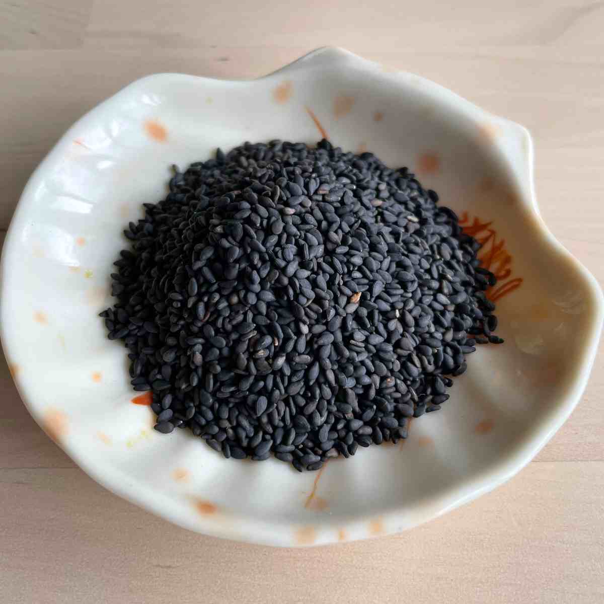 Black sesame seeds on a plate