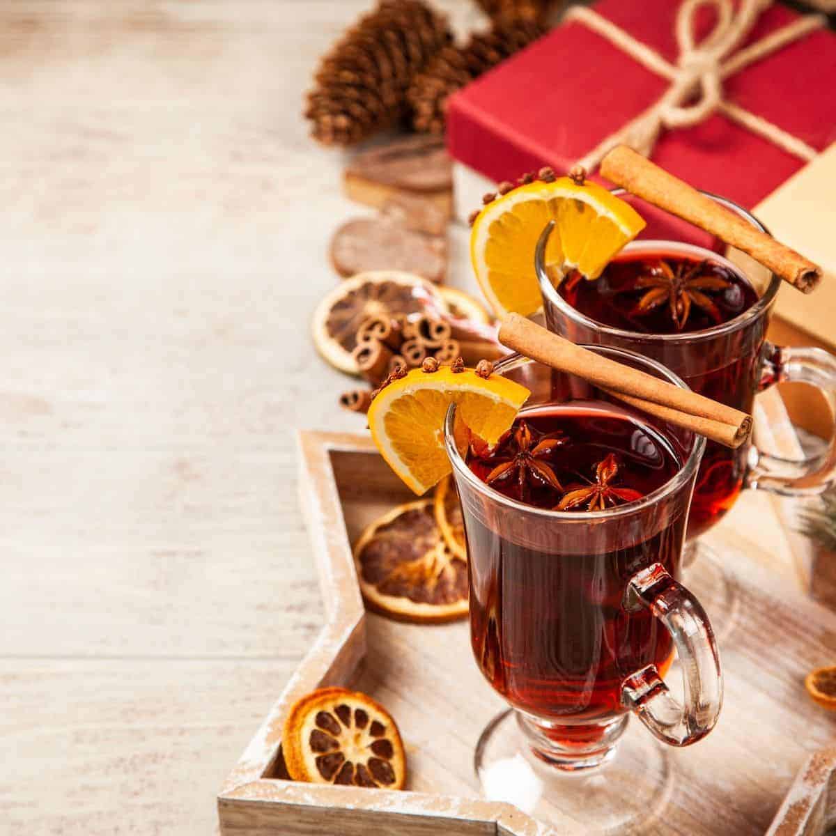 non alcoholic mulled wine in a clear glass footed mug on a star board