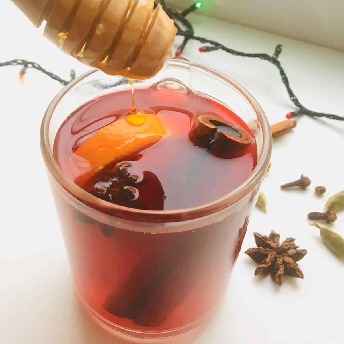 Christmas beverage with dripping honey