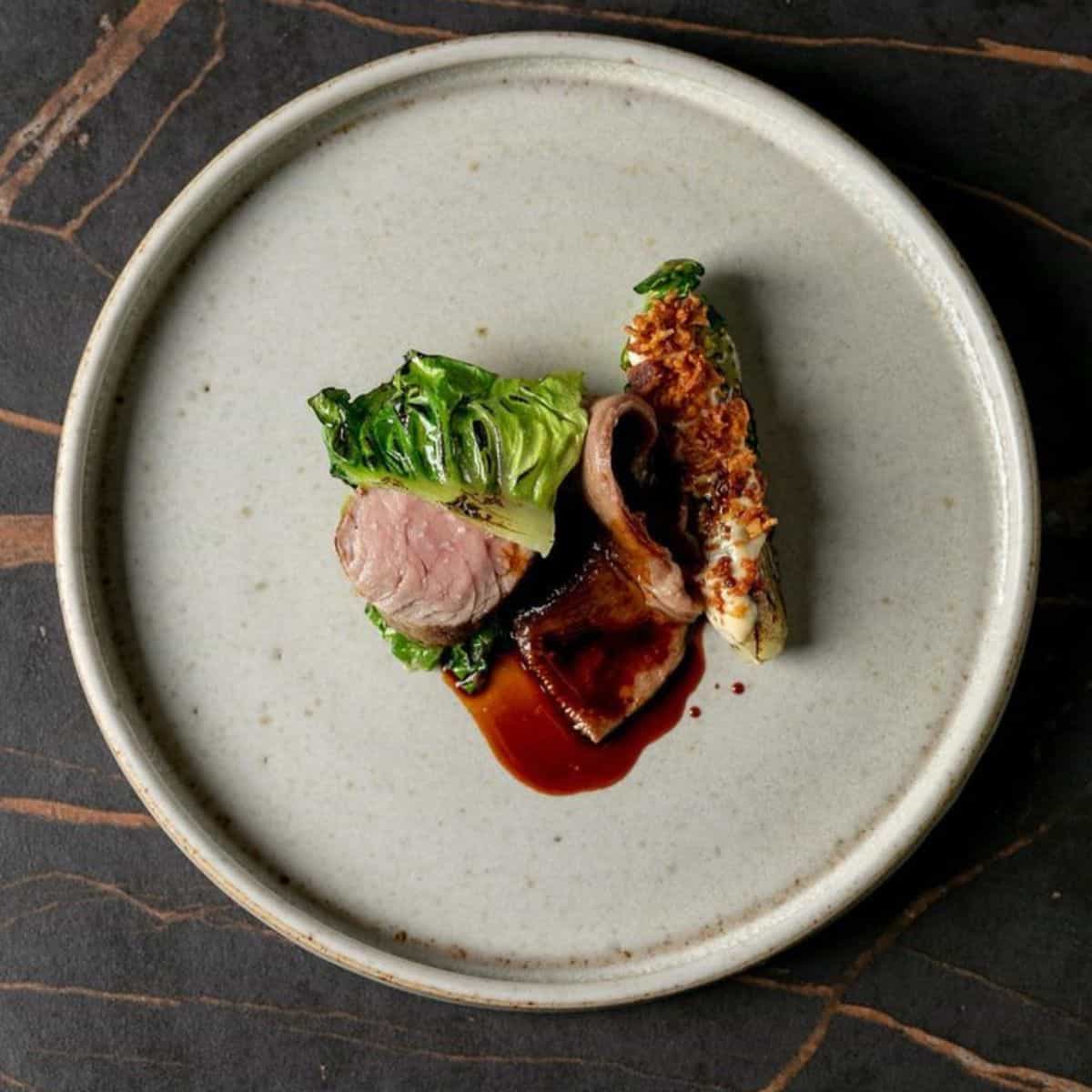 British Rose Veal saddle and tongue, BBQ lettuce, Caesar, and Veal sauce Etch by Steven Edwards