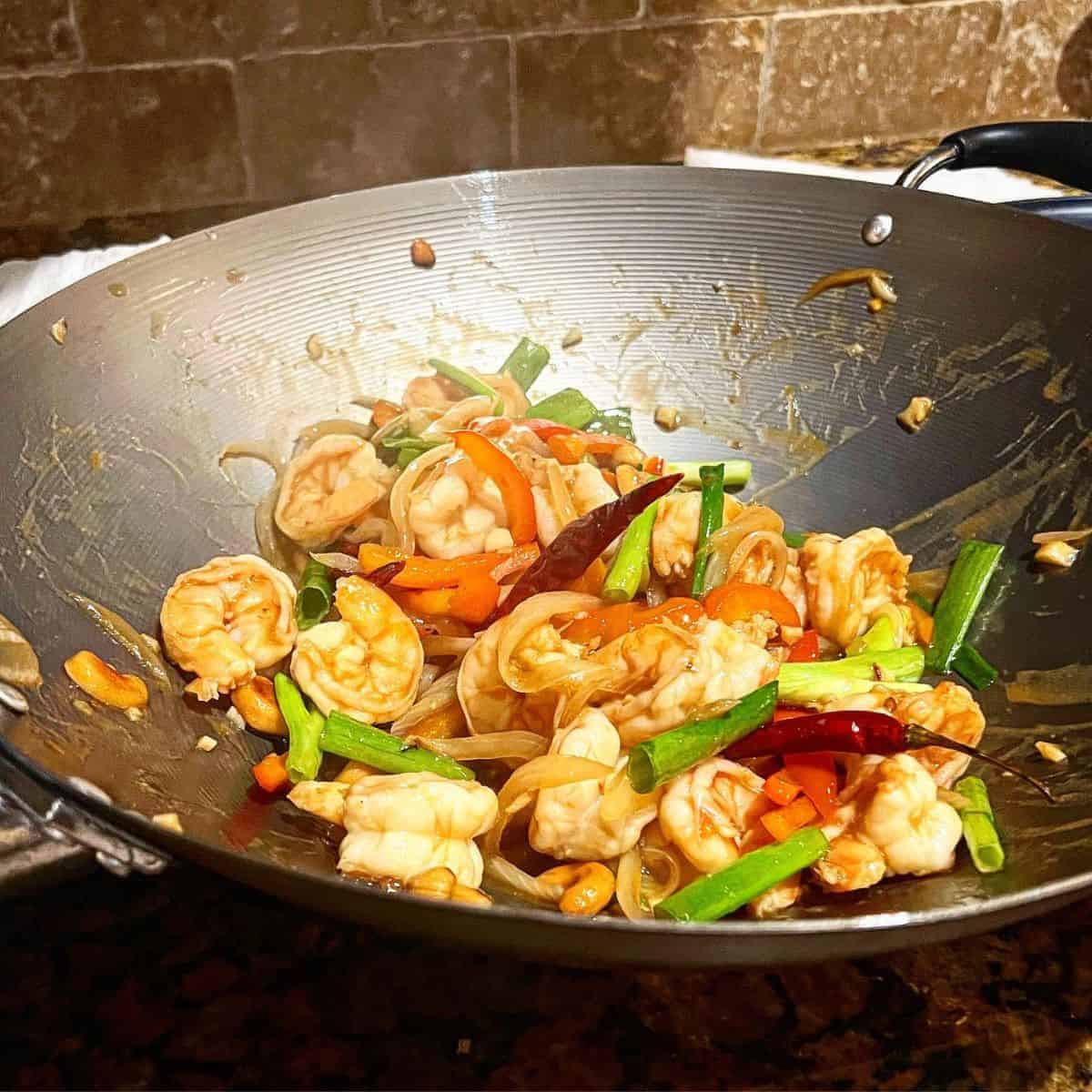 Cooking Kung Pao Shrimp in a wok