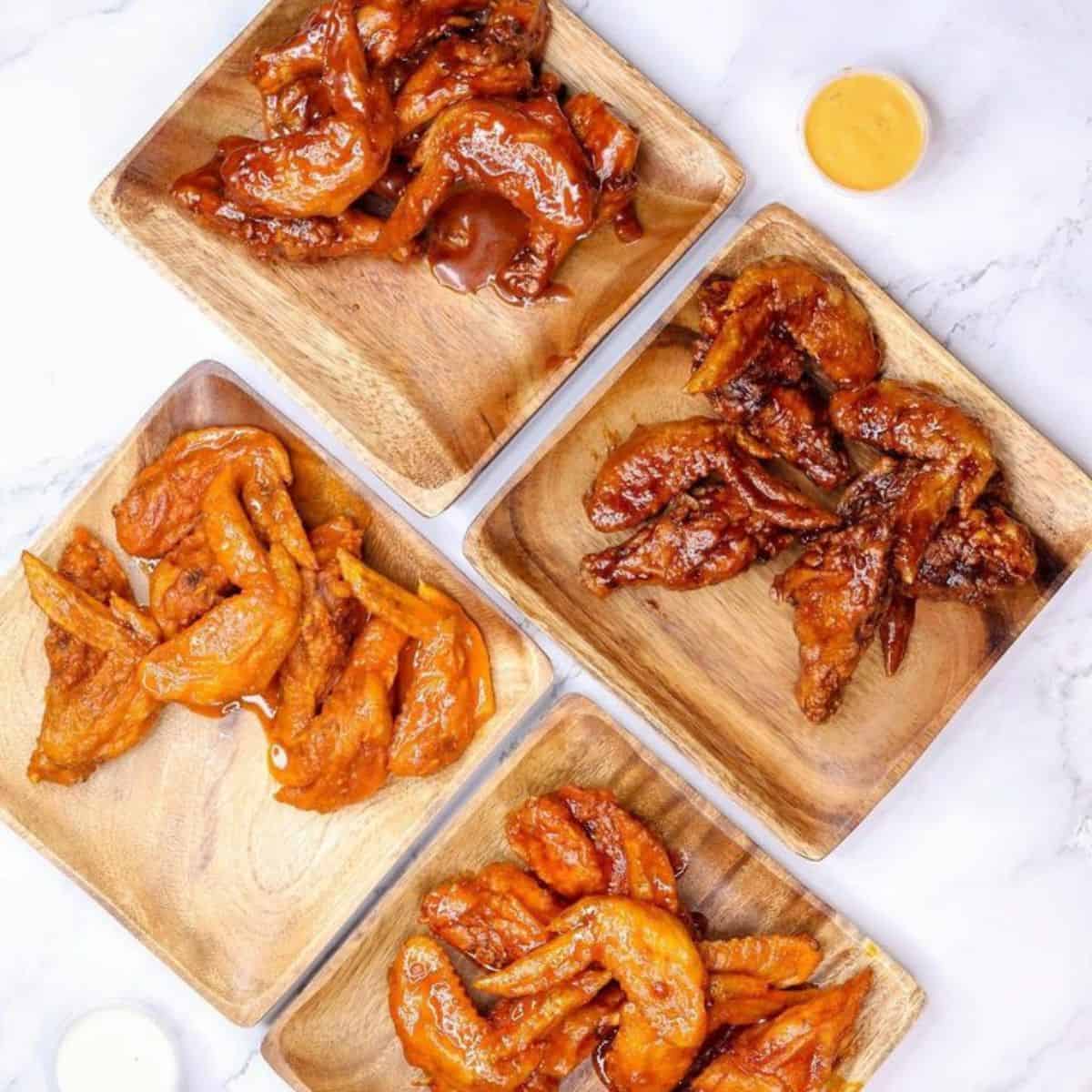 Four sets of glazed Chicken wings