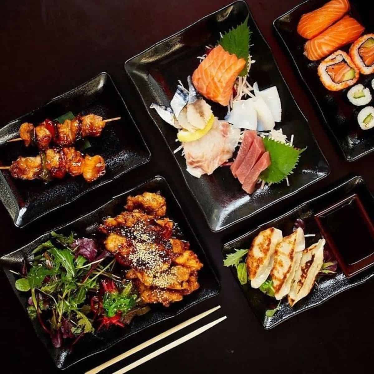 sushi and teriyaki platters on table Moshimo brighton restaurants best