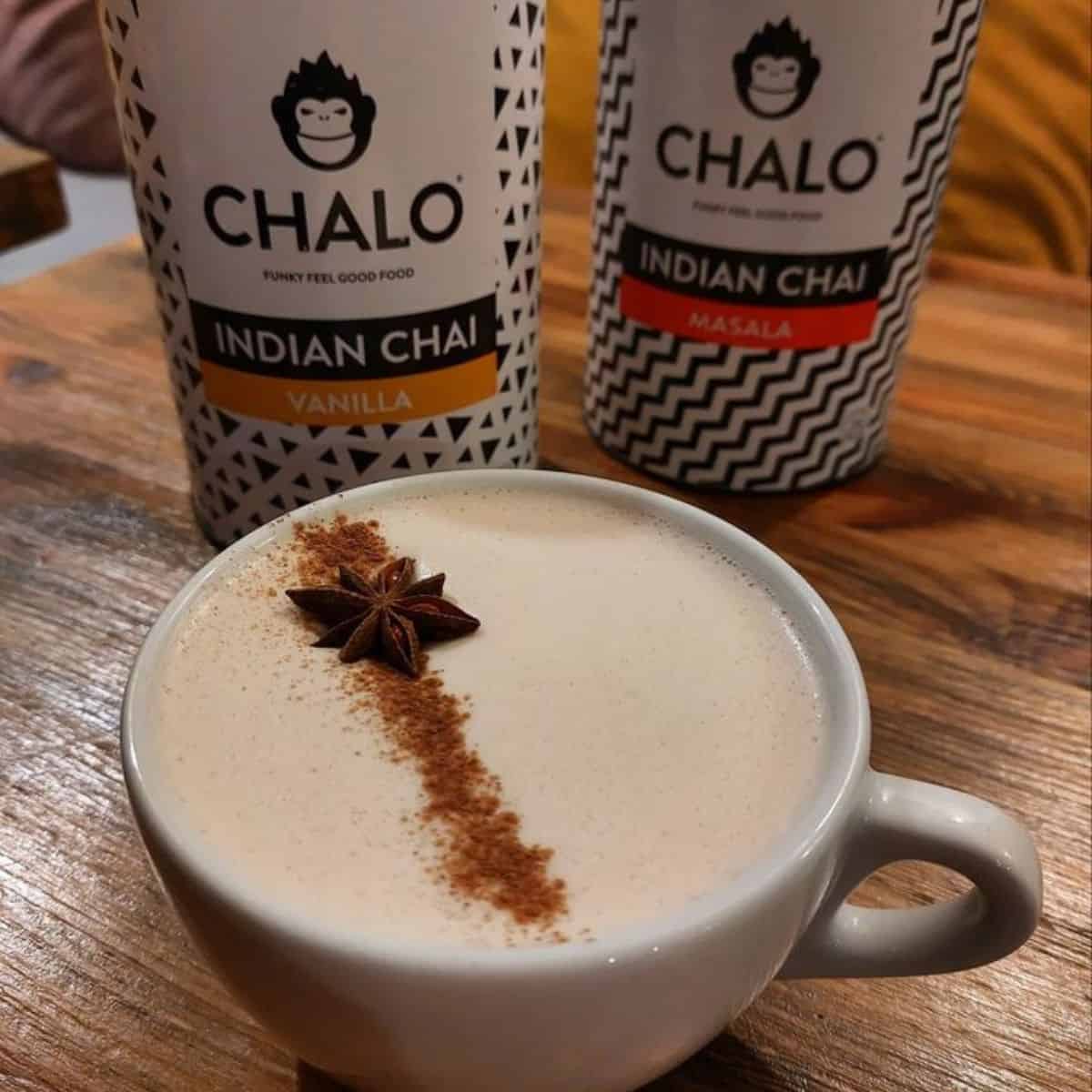 Delicious cup of latte in a wooden board with Masala and Vanilla Indian Chai