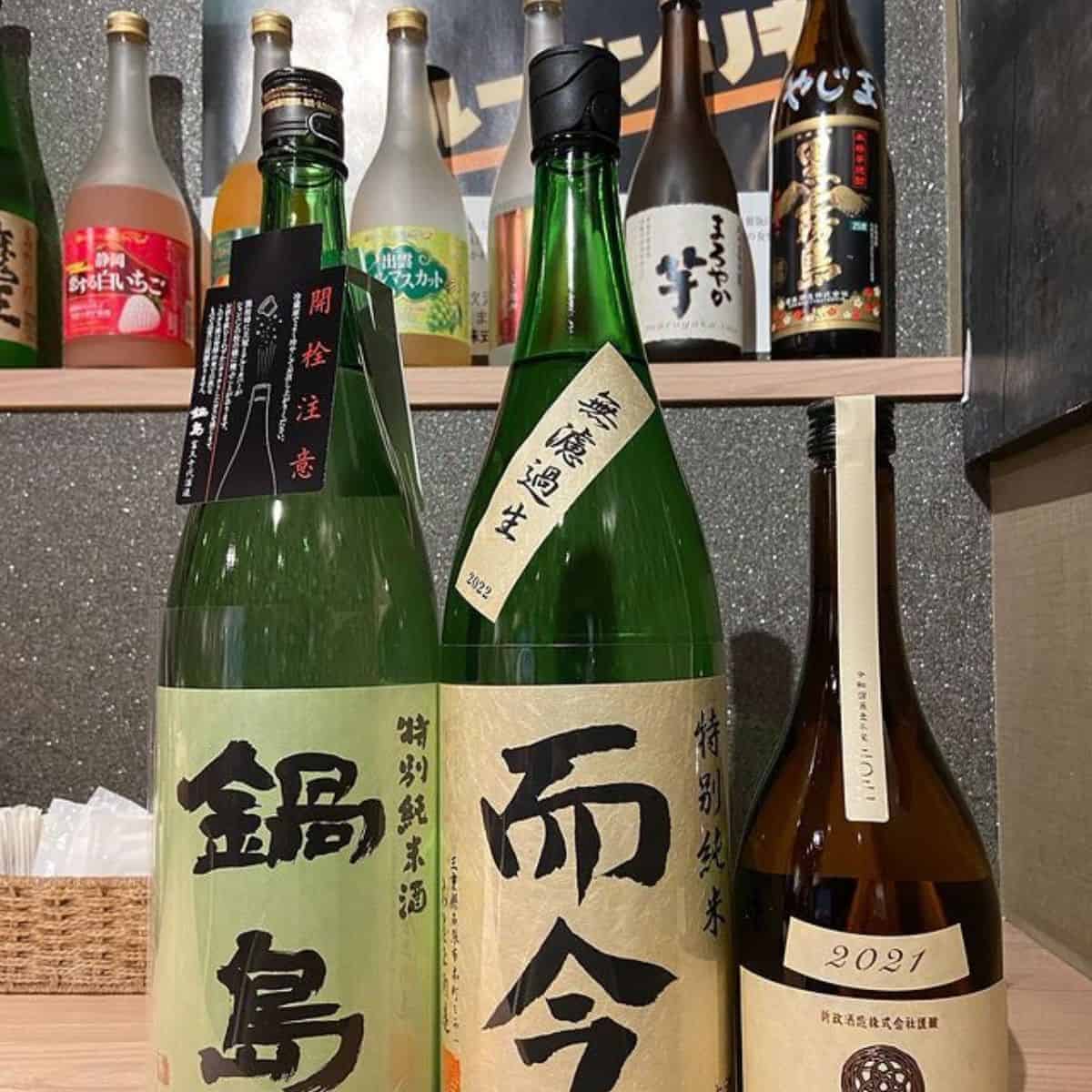 A display of different bottles of Sake