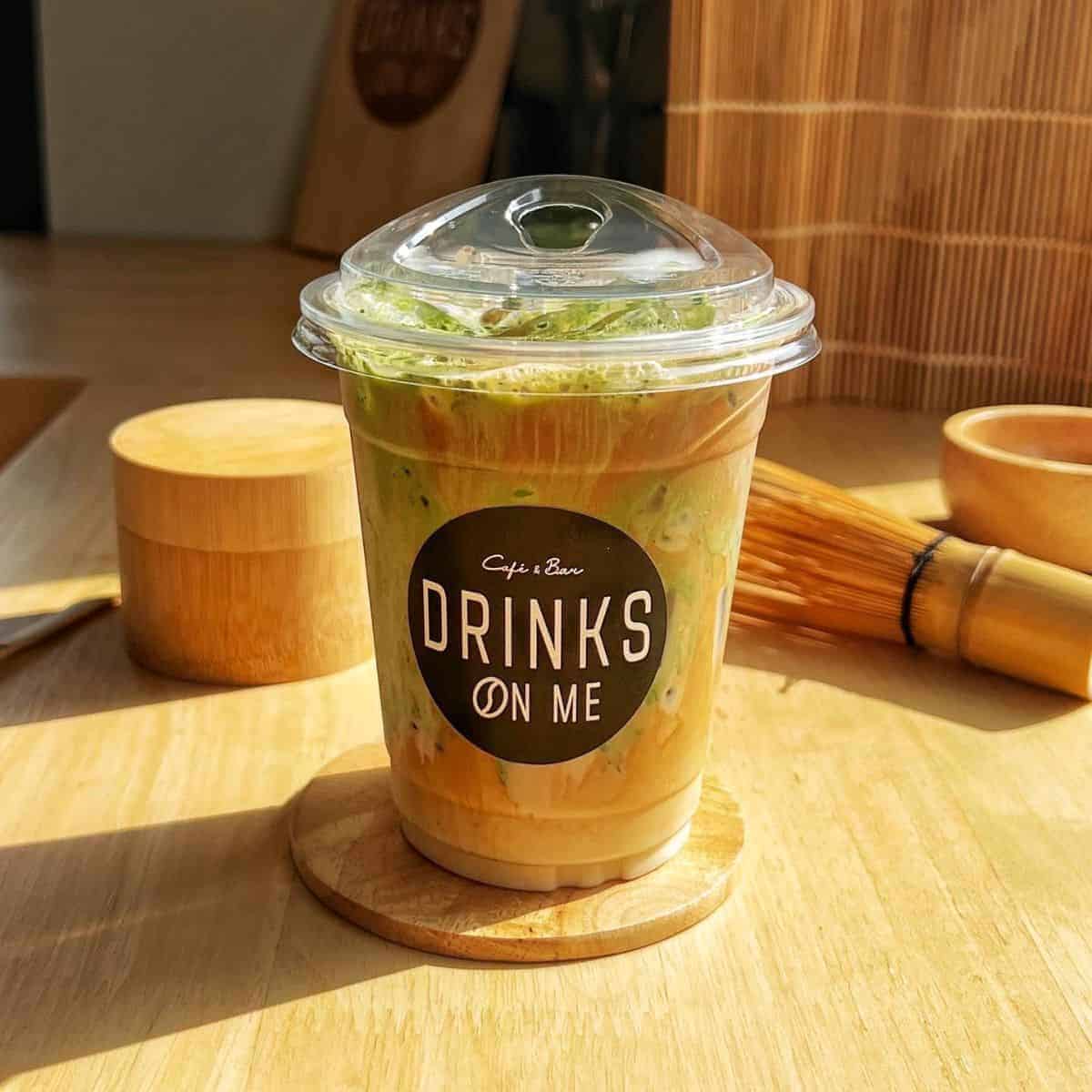 Beautiful mixture of matcha and coffee in a plastic cup
