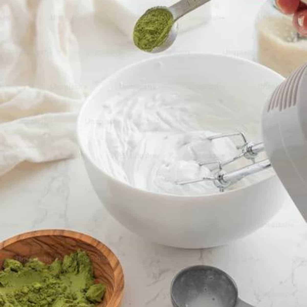 Electric mixer used in mixing cream cheese and matcha powder to make a green cheesecake