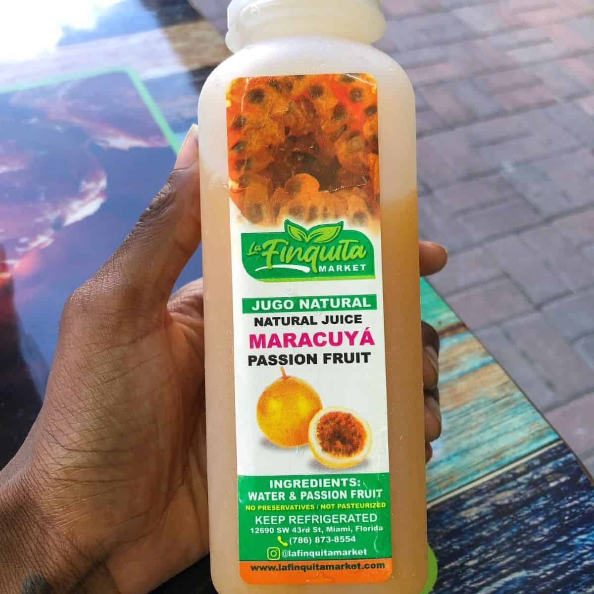 Natural passion fruit juice in a white plastic container