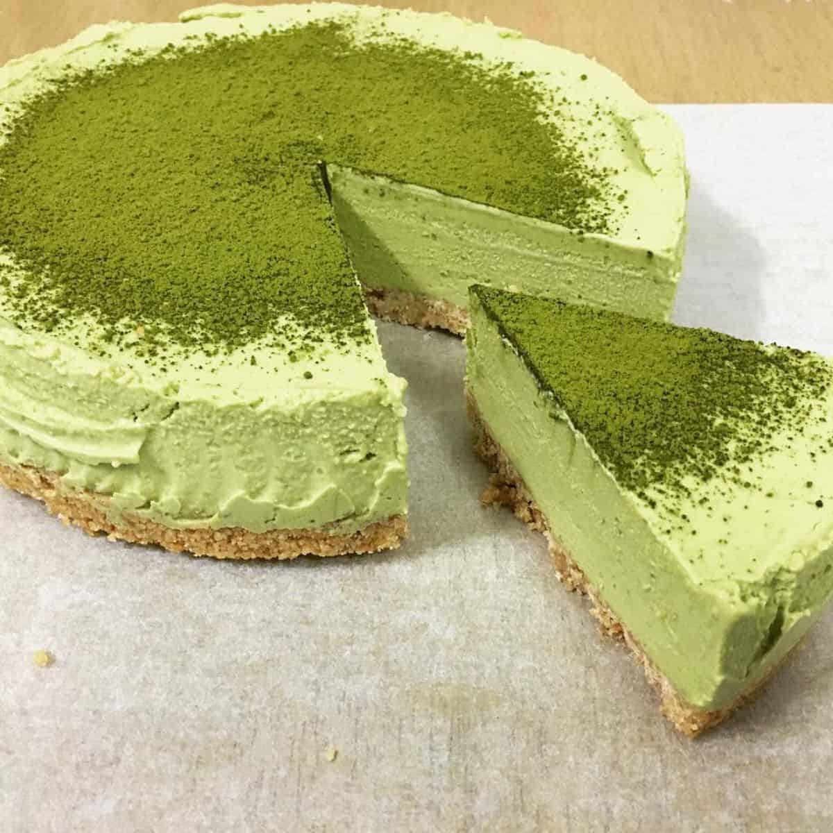 One layer of no bake matcha cheesecake with matcha powder as toppings