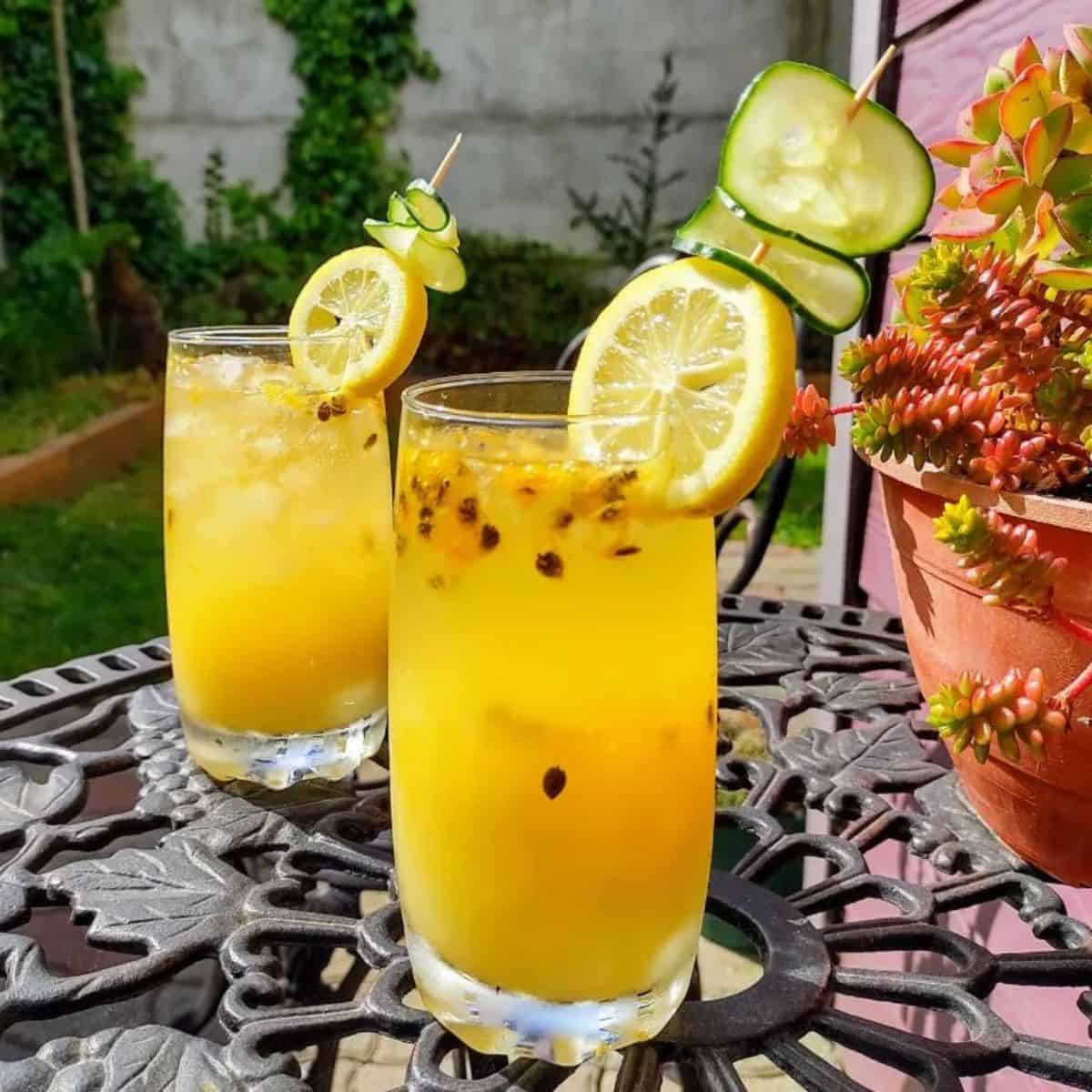 Two glasses of tropical cocktails with passion fruit syrup