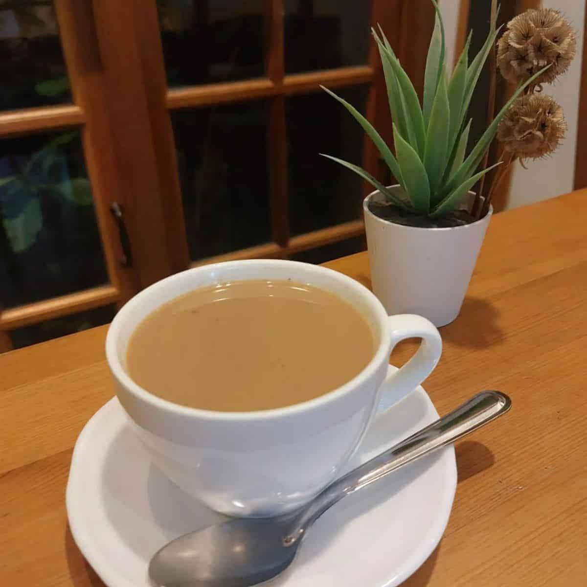 Smooth texture and aromatic cup of tea in a white cup