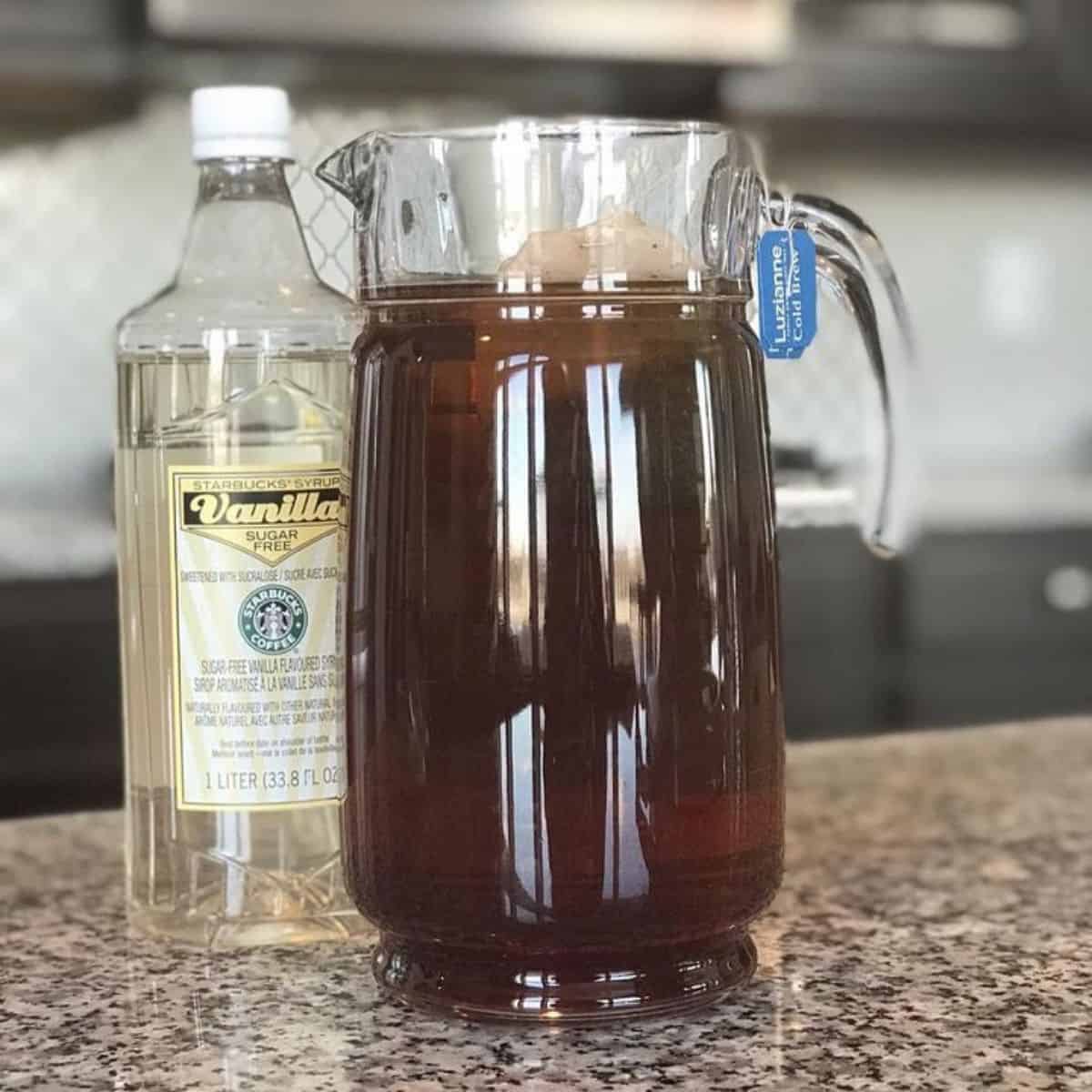 A bottle of natural sweetener and black iced tea