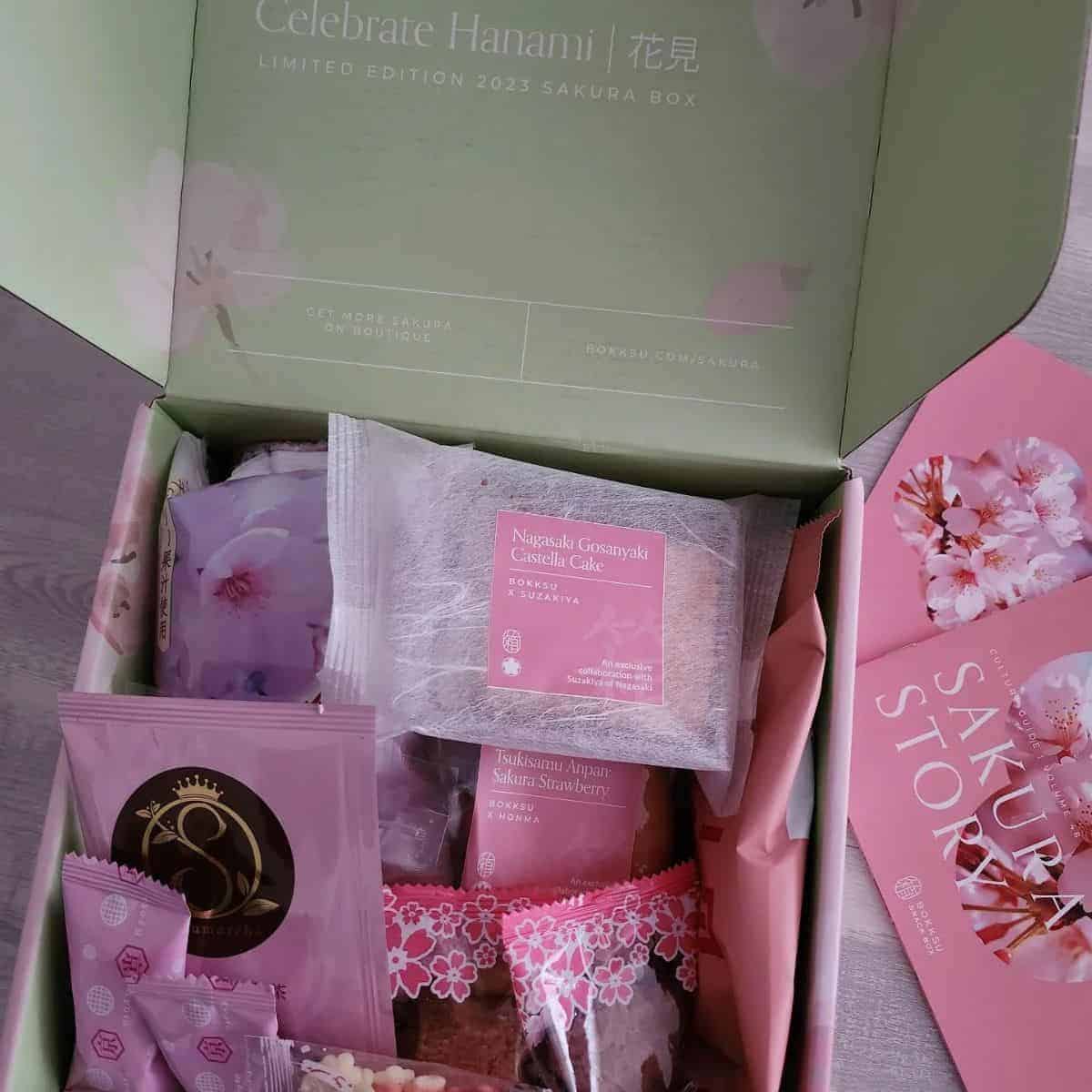Delicate green and pink coloured Bokksu with purple and pink candies